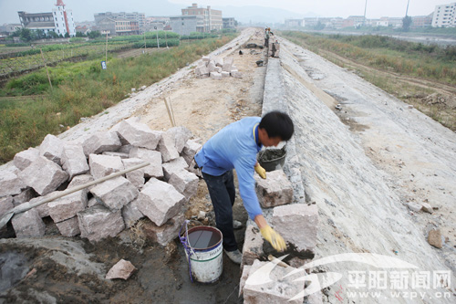 98km防洪堤的堤身,护坡及部分防浪墙,还有4座涵闸的闸室部分.